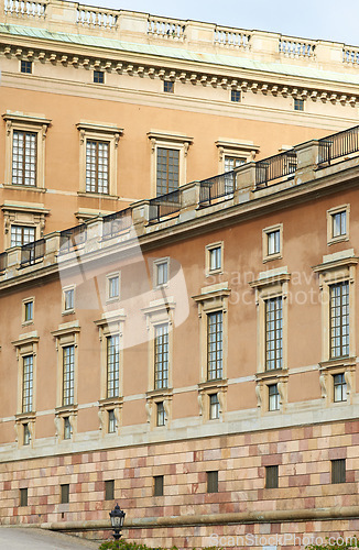 Image of Vintage, building and architecture of Royal Castle in Stockholm with wall, windows and street view. Travel, landmark and medieval palace in Sweden with history, culture and retro holiday destination.