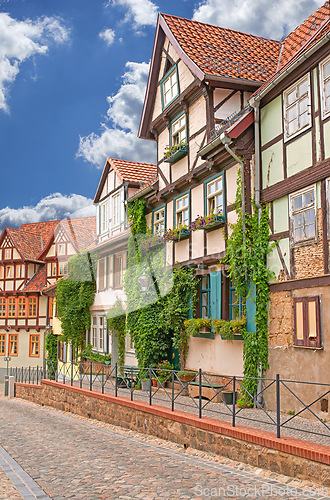 Image of Village, buildings and facade with heritage, architecture in traditional, culture and retro as tourist attraction in Germany. House, vintage and street in countryside, neighborhood or community