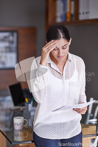 Image of Stress, paperwork and business woman reading in office for corporate finance data project. Frustrated, doubt and worried professional female financial advisor working with document in workplace.