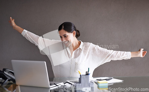 Image of Happy, celebration and woman with laptop in office for good news, job promotion or career achievement. Smile, professional and female financial advisor with completed finance project on computer.