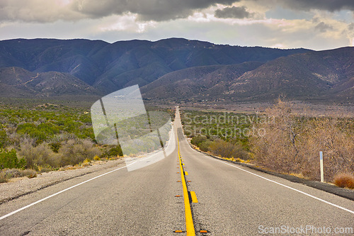 Image of Mountain, road trip and natural landscape for travel, holiday and scenery at Anza-Borrego Desert State Park in California. Nature, cloudy sky and highway for journey, vacation and outdoor adventure.