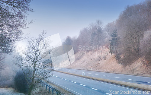 Image of Highway, road trip and desert landscape for winter travel, holiday or natural scenery in countryside. Nature, trees and street for journey, vacation or outdoor adventure with sky, relax and adventure