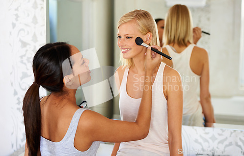 Image of Makeup, brush and woman with friend in bedroom for bonding and getting ready together at home. Cosmetics, happy and female people with cosmetology face routine for party or ladies night in apartment.