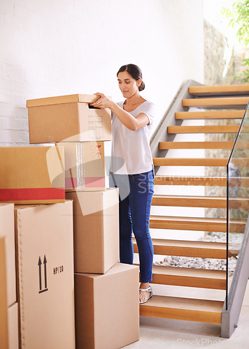 Image of Woman, new home and moving boxes for property investment, rental apartment or real estate loan. Smile, tenant and female person carrying cardboard package for logistics, relocation or renovation.