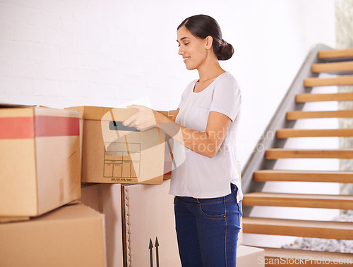Image of Boxes, moving and woman in home for real estate, property investment and mortgage of new apartment. Homeowner, happy and female person with cardboard package for growth, relocation or renovation.