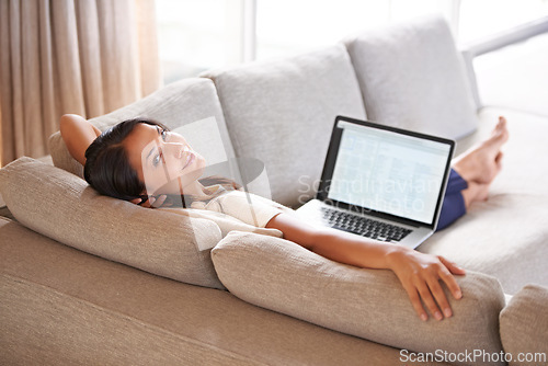 Image of Woman, relax and laptop screen for remote work, sofa and lounge to connect to wifi and portrait smile. Female person, copywriter and couch in living room, working from home and online for network