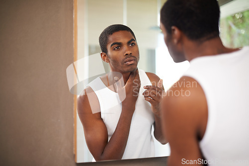 Image of Bathroom, face and black man grooming for skincare or self care with treatment for guy. African male person, morning and healthcare with dermatology for results of soft, shine and glow in mirror