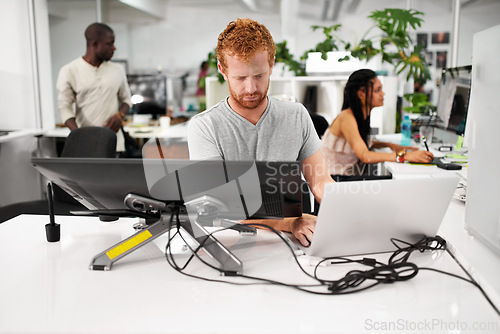 Image of Man, computer or graphic designer with laptop for technology or future of media project in office. Person typing, online or desktop monitor on creative software for startup, creativity or business