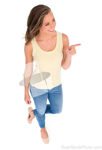 Image of Woman, fashion and pointing for recommendation, sale or discount in studio with isolated white background. Top view, hand gesture and happy model for advertising, marketing or promotion on mockup.