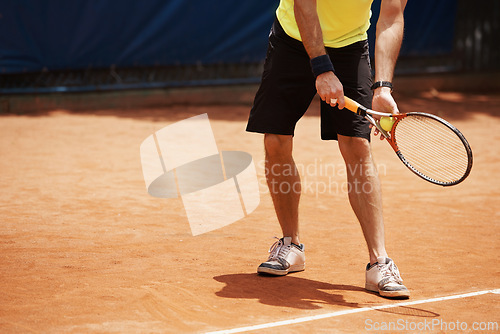 Image of Tennis, sports and male player on court, outdoor turf and exercise for cardio fitness or fun. Racket, ball and athletic man with mockup space, training and practice for performance or competition