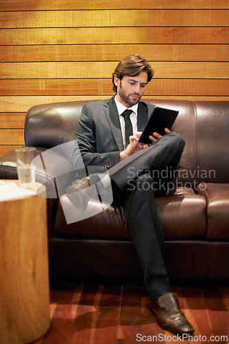 Image of Businessman, office and lobby for tablet, scroll and formal for job and workplace in corporate. Professional male person, browsing and research for company, startup and online in accounting firm