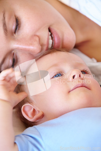 Image of Baby, bonding and happy with mom, relaxing and love together with child and care for motherhood. Infant, mother and smile for affection, nurture and home for growth and babysitting with family