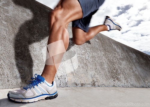 Image of Legs, workout and athlete running on road for energy, exercise and practice for marathon in city. Mock up, person and runner in street for cardio of speed for momentum in sports and wellness