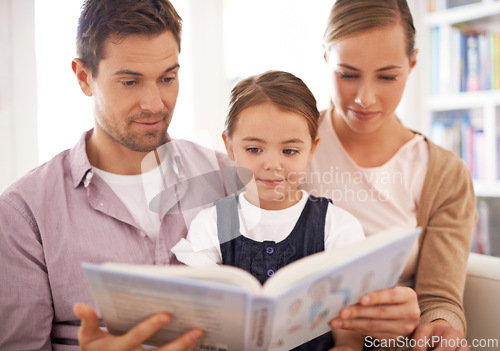 Image of Parents, child and reading at home, sofa and child development in home schooling and bonding. Mom, dad and toddler on couch, living room and smile while learning in book and fairytale stories