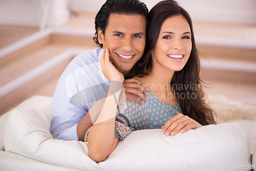 Image of Relax, hug and portrait of happy couple on couch for weekend bonding, romance and connection in home. Love, support and trust in marriage, man and woman on sofa with embrace, wellness and smile.