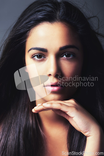 Image of Hair, beauty and woman in portrait, cosmetics treatment or keratin for growth and texture on grey background. Dermatology, long and straight hairstyle with haircare, wellness and face in studio