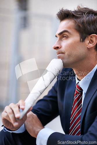 Image of Businessman, thinking and newspaper for information of corporate company for news of job. Man, thoughtful and working as employee of business and professional for accounting career in suit outdoor