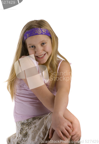 Image of Girl Smiling with Crossed Legs 