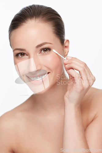 Image of Woman, face and beauty with cotton swab for hygiene and skincare wellness, dermatology and self care on white background. Portrait, earbud and clean skin for glow and natural cosmetics in studio