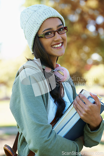 Image of Portrait, smile and books for education with student outdoor on campus for learning, growth or development. Face, study and scholarship with woman at college, school or university for knowledge