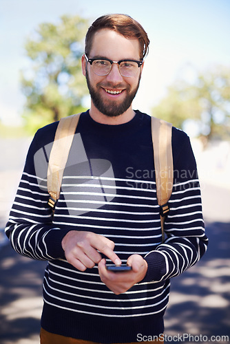 Image of Portrait, phone and man in outdoors for education, student and scrolling on university app or internet. College campus, male person and typing a message or check email, online and communication