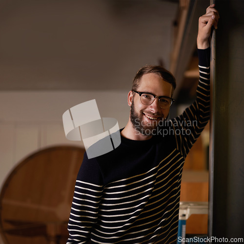 Image of Man, portrait and confident in home to relax, smile and pride for comfort or enjoyment in living room. Male person, glasses and happy with eyewear for wellness, satisfaction and face in apartment