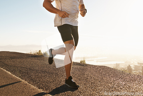 Image of Legs, sneakers and running in street for fitness, cardio and health outdoor with fresh air and training for marathon. Sports, exercise and athlete person in city for workout, wellness and endurance