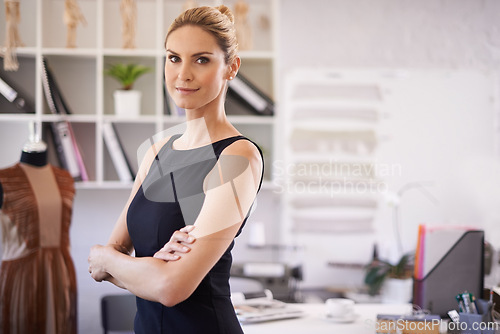 Image of Fashion designer, crossed arms and portrait of confident woman in office for design, workshop or startup career. Professional, creative workplace and person with clothing, fabric and textile boutique