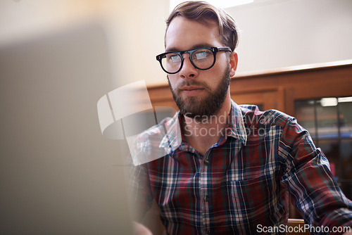 Image of Man, laptop and glasses for planning, freelancer and online or email for communication. Male person, remote work and notification in home office, reflection and browse on internet or app and website