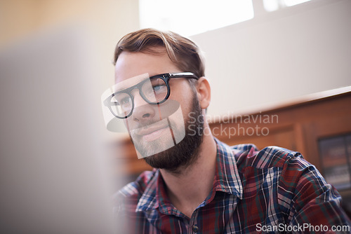 Image of Man, laptop and glasses for internet, freelancer and online or email for communication. Male person, remote work and notification in home office, reflection and browse for research on app and website
