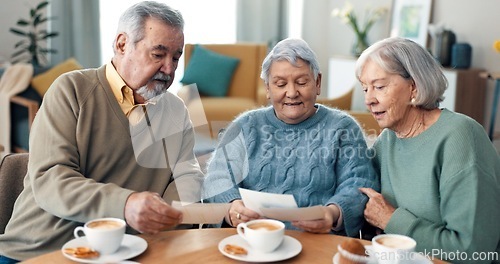 Image of Coffee, reading and senior friends in living room of nursing home with letter or invitation. Smile, conversation and group of elderly people in retirement drinking cappuccino in lounge at house.