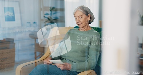 Image of Photograph, memory and senior woman in living room thinking with nostalgia or history. Remember, album and elderly female person in retirement looking at pictures on sofa in lounge at house.