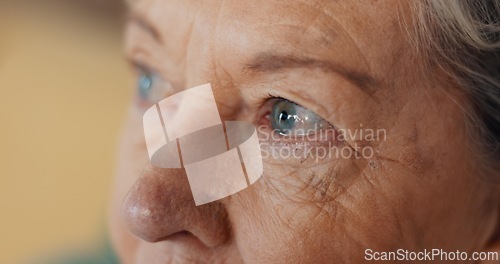 Image of Eyes, thinking and senior woman at nursing home with fear, stress and worry or depression in closeup. Anxiety, face and elderly lady with nostalgia, doubt and dementia for memory loss or Alzheimer