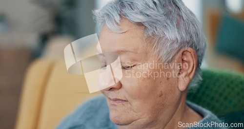 Image of Face, memory or nostalgia with senior woman on sofa of living room in home to relax for retirement. Peace, thinking or wellness with elderly person closeup in apartment for break, rest or time off