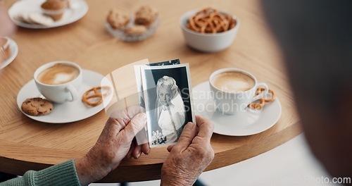 Image of Senior people, hands and photograph memory in home for nostalgia, history and to remember. Breakfast, elderly friends and pov at tea table with pictures of album, wedding or photography in retirement