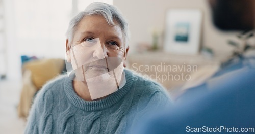 Image of Talking, support and senior woman with nurse for conversation, communication or chat in house. Happy, relax and elderly lady in living room of home and speaking to friend or caregiver for healthcare