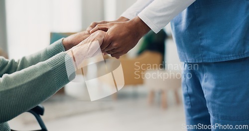 Image of Nurse, senior patient and holding hands in closeup for support, help and recovery in retirement. Physiotherapist, care and elderly person with disability in wheelchair at clinic for rehabilitation