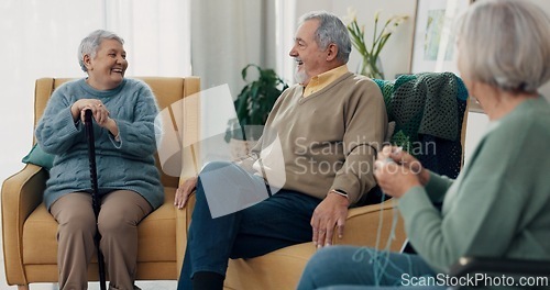 Image of Conversation, happy and senior friends in living room of nursing home for communication. Smile, discussion and group of elderly people in retirement talking, bonding and relaxing in lounge at house.