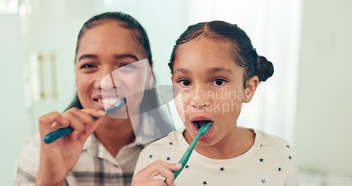 Image of Portrait, brushing teeth and mother with daughter, morning routine and healthy in bathroom. Face, family or mama with kid and child development with wellness or toothbrush with fresh breath or dental