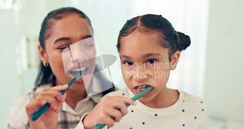 Image of Brushing teeth, mother and daughter with toothbrush, portrait and dental for health, morning routine and happy. Bathroom, home and hygiene with mama, girl and oral care with cleaning mouth and child