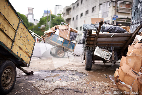 Image of Garbage, cart and trash in city outdoor for waste management, recycling and rubbish in neighborhood. Community, scrap and boxes of junk material in sao paulo with dump collection, old litter and pile