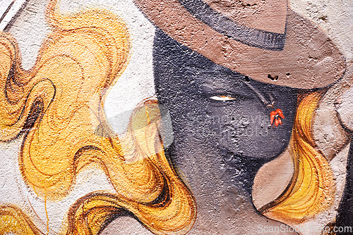 Image of Graffiti, paint and wall mural in neighborhood with woman illustration and creativity in the city. Urban, art and color on a street with town drawing on a building in Sao Paulo outdoor with craft