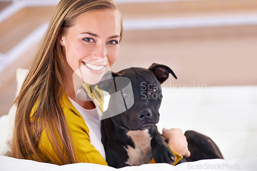 Image of Woman, dog and relax on sofa in portrait, smile for pet love and bonding at home with domestic canine. Happy, positive and trust with foster or adoption, cuddle puppy in living room and animal care