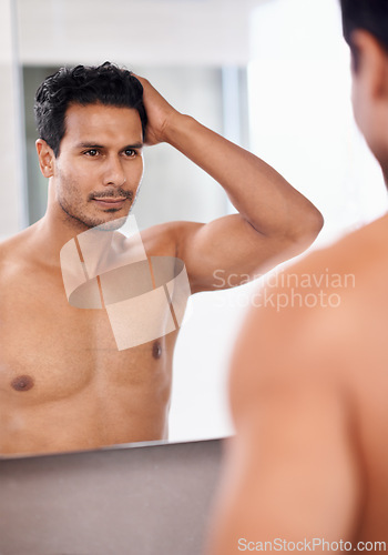 Image of Bathroom mirror, body and man with hair check in a house for skincare, wellness or morning routine. Hairline, reflection and male person with growth, texture or satisfaction after shower at home