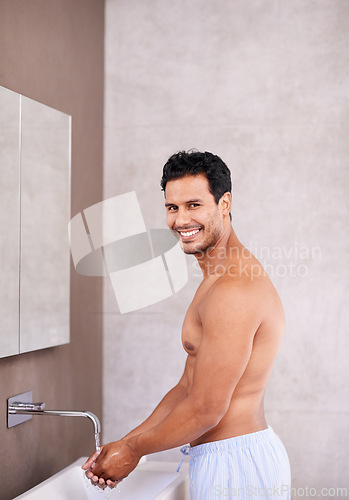 Image of Portrait, facial hygiene and water with man in bathroom for washing hands, bacteria and healthy skin. Skincare, dermatology and male person for grooming, wellness and morning routine in house.