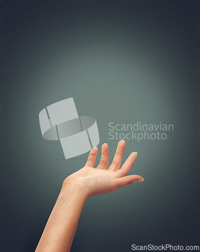 Image of Hands, help and person reaching in studio for hope, charity or guidance, care or trust on dark background space. Palm, offer and model with mockup for donation, safety or assistance, guide or support