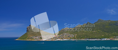 Image of Beach, drone and mountain on blue sky, paradise and tourist destination for summer vacation in nature. Aerial, ocean and sustainability in cape town, peace and outdoor travel of island environment