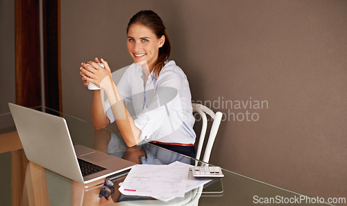 Image of Woman, laptop and coffee in home office with notes and calculator for remote work, startup or job at desk or table. Entrepreneur or worker with smile and tech for internet, research and finance