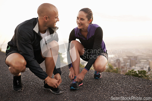 Image of Running shoes, love and couple in a road for fitness, training or morning cardio in nature together. Sneakers, shoelace and sports runner people outdoor for marathon, routine or performance workout