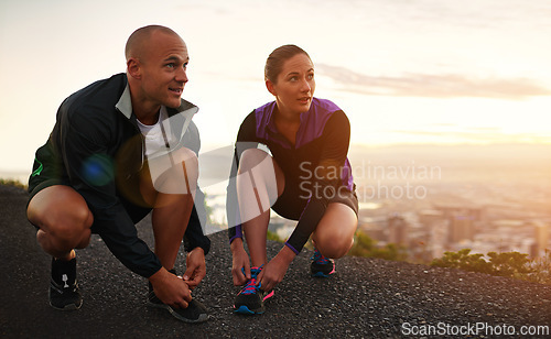 Image of Fitness, shoes and couple in a road for sunset running, training or morning cardio in nature together. Sneakers, shoelace and sports runner people outdoor for marathon, routine or performance workout